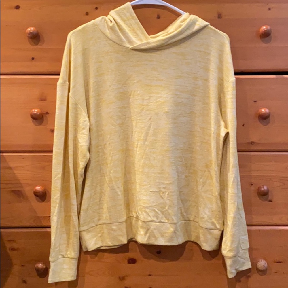Yellow hooded long sleeve shirt.